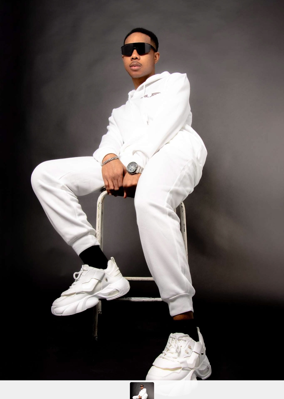 Studio portrait — full length seated