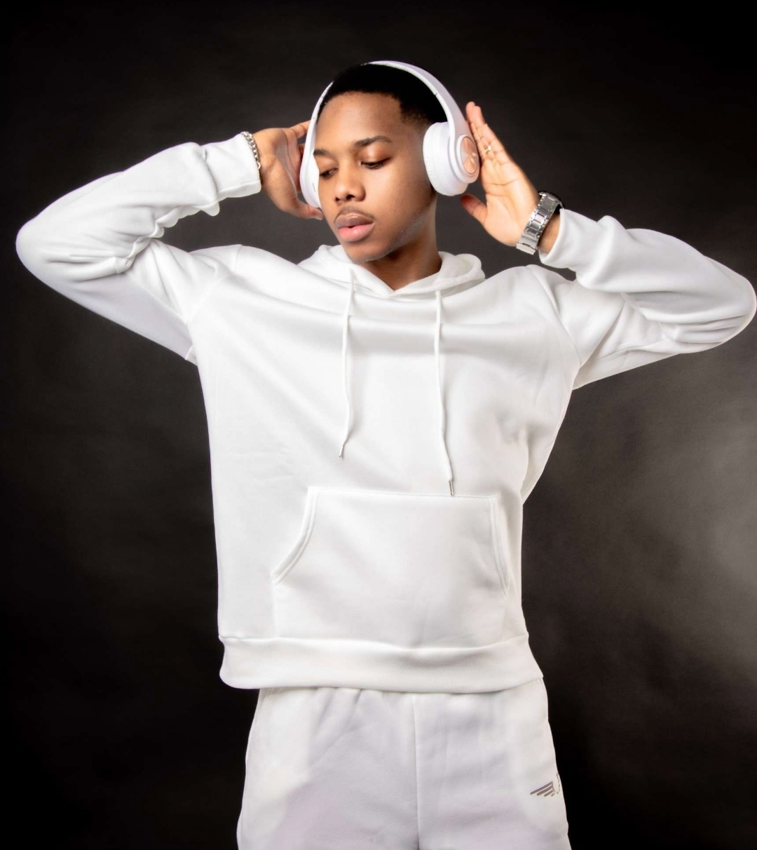 Studio portrait — white hoodie & headphones